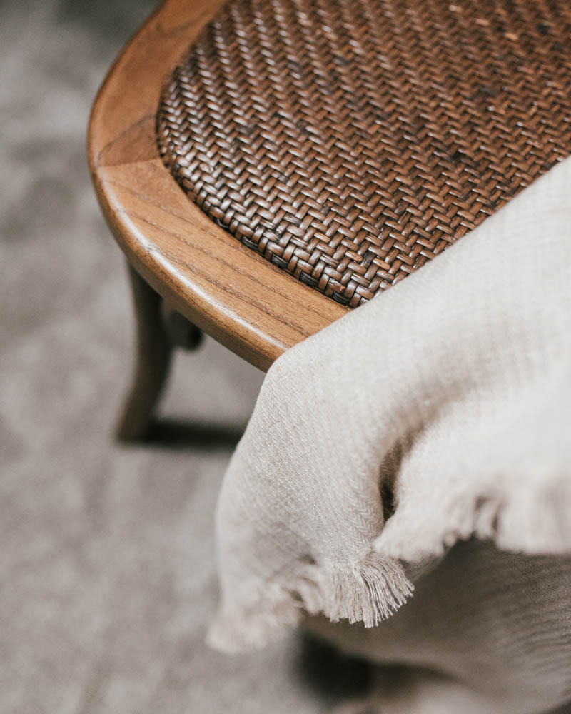 cream blanket on a chair