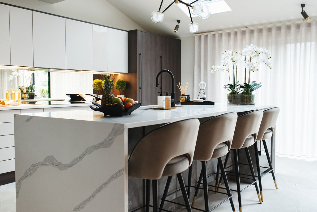interior design case study image shows a breakfast bar with four stools next to it