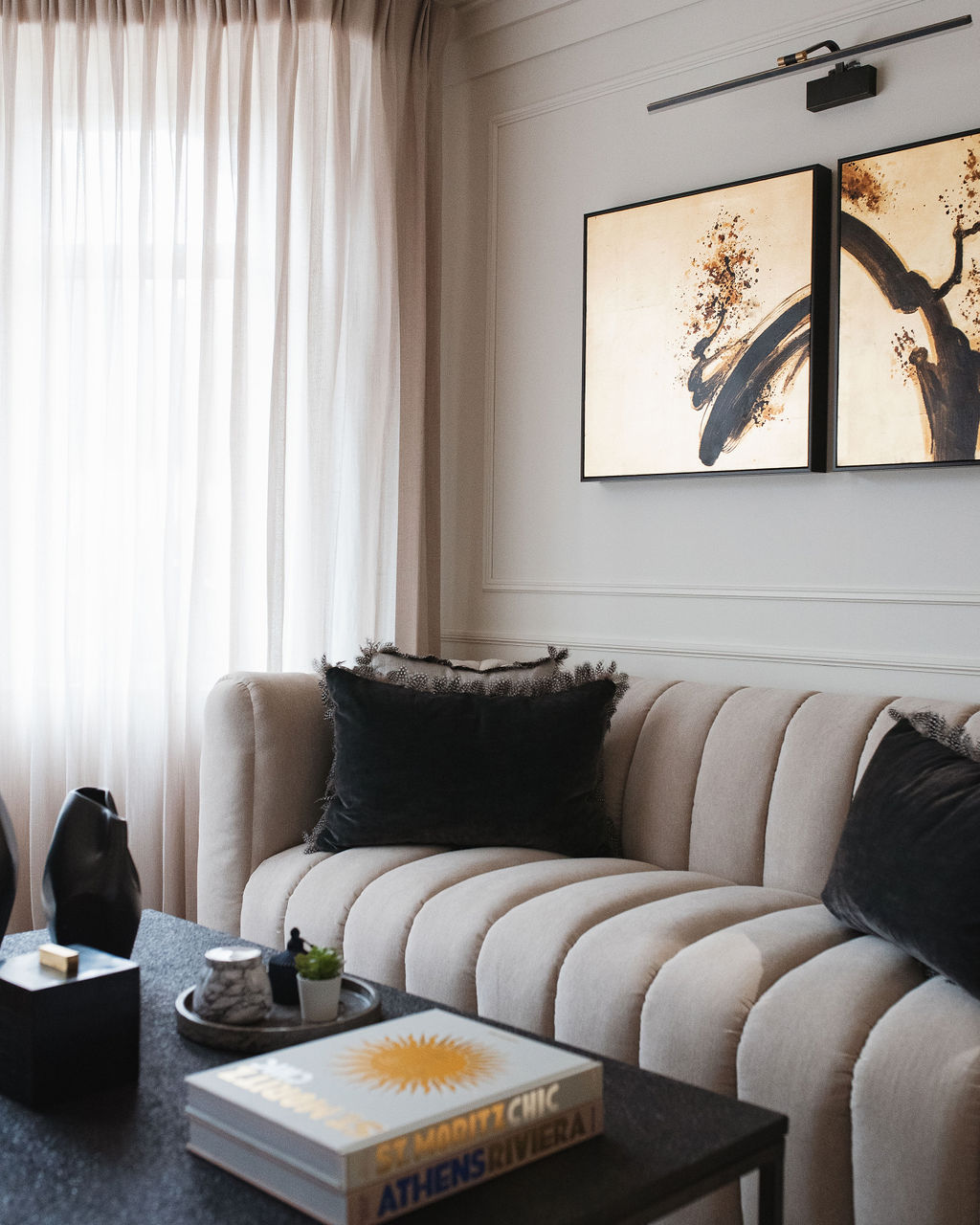 interior design of a lounge with cuff sofa and black coffee table