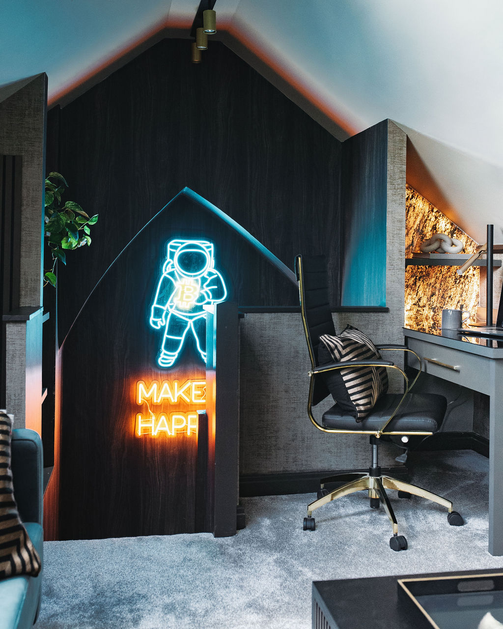 the interior of a childs bedroom with neon wall signage